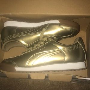 gold and white pumas.